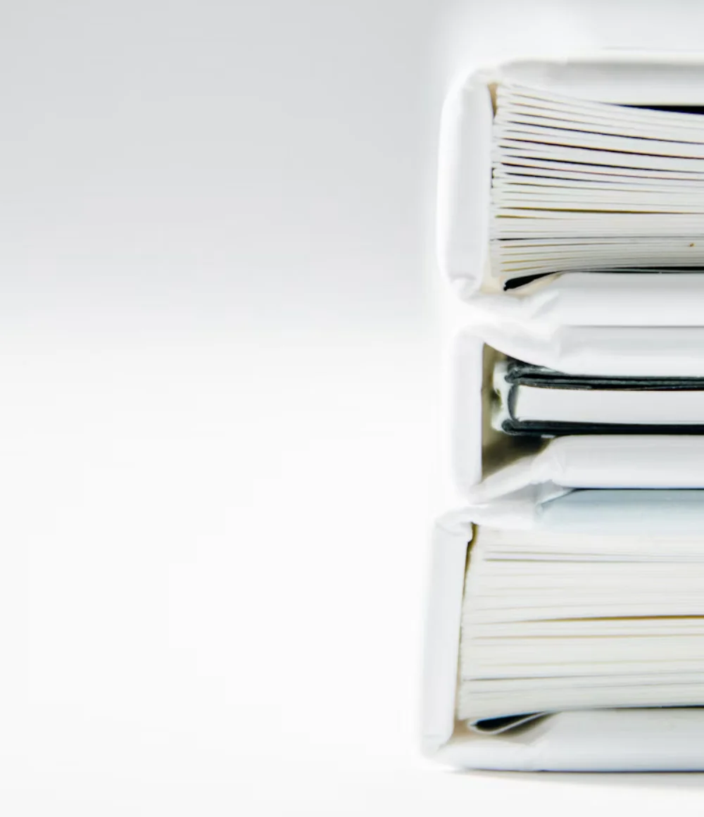 Stacked ring binders of client records